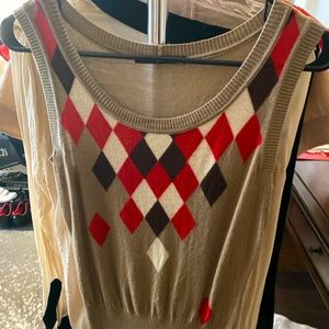 Authentic Gucci sleeveless blouse with colored pattern on front, solid on back